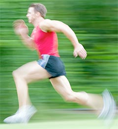 Photo of a man running at full speed.